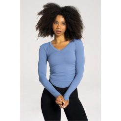 Koszulka fitness damska Gym Glamour wycięta z długimi rękawami. Niebieskie bluzki GYM GLAMOUR, s, bez wzorów, glamour, bez kołnierzyka, bez ramiączek. Za 149.99 zł.
