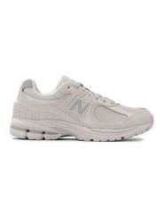 New Balance Skórzane sneakersy "2002R" w kolorze kremowym rozmiar: 38,5. Brązowe trampki New Balance, bez wzorów, z materiału, bez zapięcia. Za 543.99 zł.