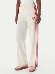 Adidas Spodnie dresowe Firebird KQ8056 Beżowy Loose Fit. Brązowe spodnie dresowe Adidas, xs, bez wzorów, z dresówki. Za 298.99 zł.
