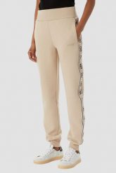 GUESS Beżowe damskie spodnie dresowe z lampasami Britney Jogger, Rozmiar S. Brązowe spodnie dresowe Guess, na co dzień, s, z aplikacjami, z dresówki. Za 489.99 zł.