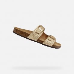 Sandały GEOX D BRIONIA Beżowy. Żółte sandały Geox, bez wzorów, ze skóry, bez obcasa, bez zapięcia. Za 314.99 zł.