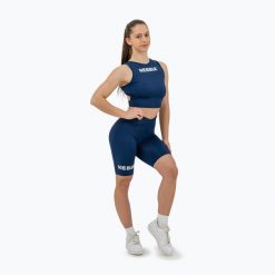 Top treningowy damski NEBBIA Gym Therapy Cropped. Niebieskie topy Nebbia, bez wzorów, bez kołnierzyka, bez ramiączek. Za 149.99 zł.