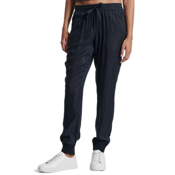 Spodnie turystyczne damskie Superdry Studios Supro Woven Jogger. Niebieskie spodnie sportowe Superdry, na lato, xs, bez wzorów, z wiskozy, trekkingowe. W wyprzedaży za 193.00 zł.