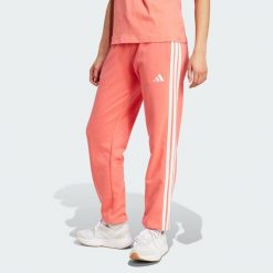 Spodnie Essentials 3-Stripes French Terry Cuffed. Białe obuwie sportowe Adidas, z materiału, bez zapięcia, na fitness i siłownię. Za 219.00 zł.
