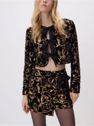 Cekinowa marynarka z kokardami - czarny. Czarne marynarki i żakiety Reserved, l, bez wzorów, z dzianiny. Za 179.99 zł.