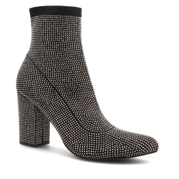 Botki Nine West. Czarne botki Nine West, bez wzorów, bez obcasa, na słupku, bez zapięcia. Za 209.99 zł.