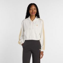Bluza damska New Balance WJ61B759SST – beżowa. Brązowe bluzy New Balance, l, bez wzorów, z dresówki, z kapturem. Za 299.99 zł.