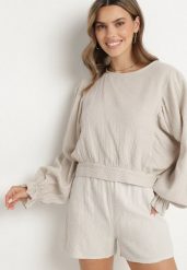 Beżowa Bluzka z Bawełny o Nietoperzowym Kroju z Wiązaniem Sepene. Brązowe bluzki Born2be, z aplikacjami, z bawełny, eleganckie, bez kołnierzyka, bez ramiączek. W wyprzedaży za 101.99 zł.