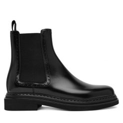 Sztyblety Dolce&Gabbana. Czarne botki Dolce&Gabbana, bez wzorów, bez obcasa, na płaskiej podeszwie, bez zapięcia. Za 3,409.00 zł.