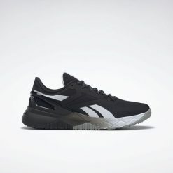 Obuwie Sportowe Damskie Reebok Nanoflex TR W Czarny. Białe obuwie sportowe Reebok, z gumy, bez zapięcia, na fitness i siłownię. Za 388.00 zł.
