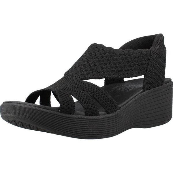 Sandały SKECHERS 120012S Czarny. Czarne sandały Skechers, bez wzorów, z materiału, bez obcasa, bez zapięcia. Za 267.99 zł.