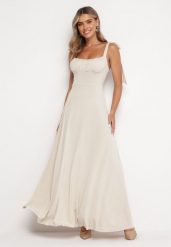 Jasnobeżowa Rozkloszowana Sukienka Maxi z Wiązanymi Ramiączkami Lisija. Brązowe sukienki Born2be, m, bez wzorów, eleganckie, bez kołnierzyka, bez ramiączek, maxi, rozkloszowane. Za 139.99 zł.
