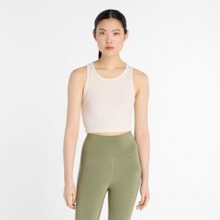 Koszulka damska New Balance WT43523PEF – beżowa. Brązowe bluzki New Balance, l, bez wzorów, z lyocellu, sportowe, bez kołnierzyka, bez ramiączek. Za 169.99 zł.