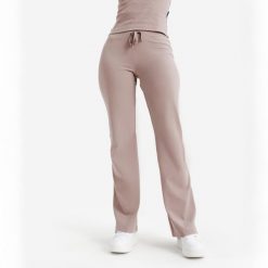 Rozszerzane legginsy damskie Elementals. Brązowe legginsy DECATHLON, s, bez wzorów, z bawełny. Za 89.99 zł.