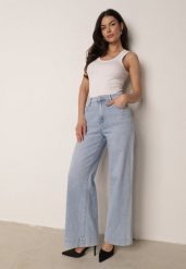 Jasnoniebieskie Jeansy z Bawełny o Szerokim Kroju z Wysokim Stanem Senoth. Niebieskie spodnie materiałowe Born2be, na co dzień, l, bez wzorów, z bawełny, z podwyższonym stanem. Za 109.99 zł.