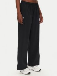 Under Armour Spodnie dresowe Rival 1386453 Czarny Wide Leg. Czarne spodnie dresowe Under Armour, s, bez wzorów, z dresówki. Za 159.99 zł.