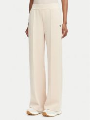 Guess Spodnie dresowe V6YB18 K4315 Beżowy Regular Fit. Brązowe spodnie dresowe Guess, l, z aplikacjami, z dresówki. Za 394.99 zł.