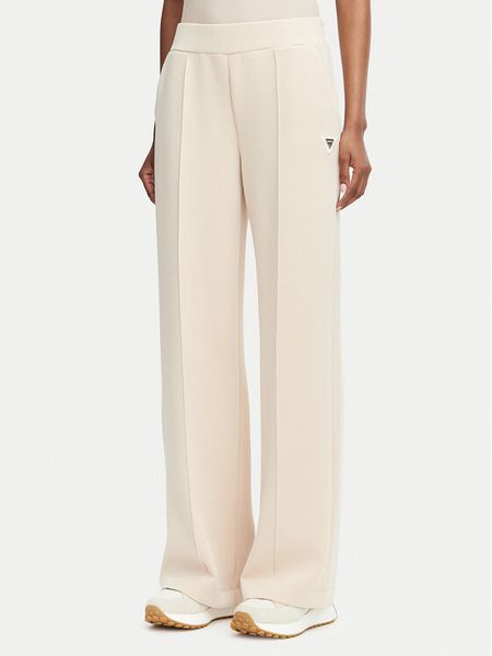 Guess Spodnie dresowe V6YB18 K4315 Beżowy Regular Fit. Brązowe spodnie dresowe Guess, l, z aplikacjami, z dresówki. Za 318.99 zł.