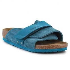 Klapki damskie Birkenstock Kyoto. Niebieskie klapki Birkenstock, bez wzorów, z materiału, bez obcasa. Za 784.75 zł.