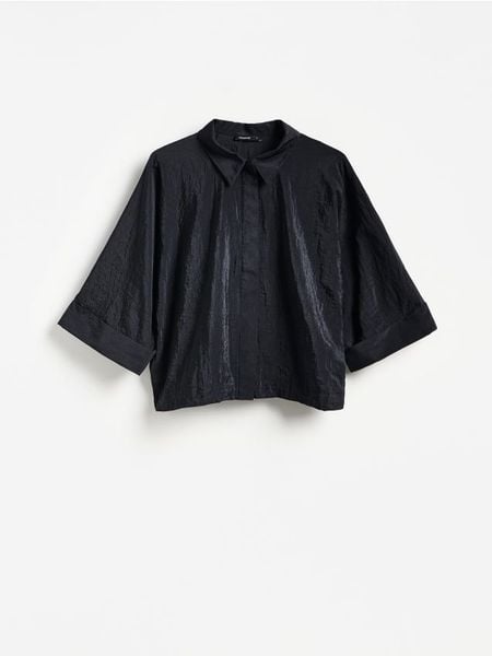 Koszula ze ściągaczem - czarny. Czarne koszule Reserved, l, bez wzorów, z tkaniny, bez kołnierzyka, bez ramiączek. Za 129.99 zł.