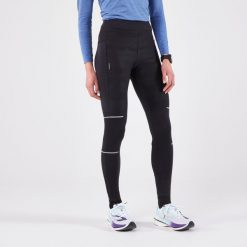 Legginsy do biegania damskie Kiprun Warm Rain ocieplane. Czarne legginsy KIPRUN, m, bez wzorów, z elastanu. Za 189.99 zł.