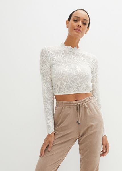 Krótka bluzka koronkowa w ludowym stylu, długi rękaw. Białe bluzki bonprix, bez wzorów, z koronki, bez kołnierzyka, bez ramiączek. Za 159.99 zł.