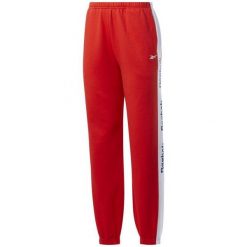 Spodnie Dresowe Damskie Te Linear FL Logo. Czerwone spodnie dresowe Reebok, bez wzorów, z dresówki. Za 142.99 zł.
