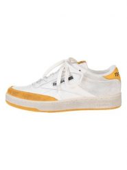 Reebok Skórzane sneakersy "Club C Revenge" w kolorze biało-żółtym rozmiar: 42. Białe trampki Reebok, bez wzorów, bez zapięcia. Za 310.19 zł.