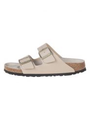 Birkenstock Klapki "Arizona" w kolorze kremowym rozmiar: 38. Brązowe klapki Birkenstock, bez wzorów, z otwartym noskiem, bez obcasa. Za 371.59 zł.