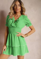 Zielona Rozkloszowana Sukienka z Gumką w Talii i Ozdobnymi Falbankami przy Dekolcie Arcidia. Zielone sukienki Renee, na imprezę, bez wzorów, z jeansu, boho, bez kołnierzyka, bez ramiączek, mini, oversize. Za 79.99 zł.
