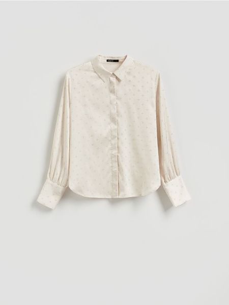 Koszula ze strasem - złamana biel. Koszule Reserved, l, bez wzorów, z tkaniny, bez kołnierzyka, bez ramiączek. Za 159.99 zł.