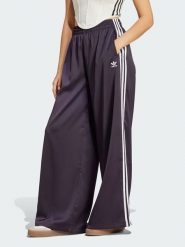 Adidas Spodnie dresowe w kolorze fioletowym rozmiar: 40. Różowe spodnie dresowe Adidas, bez wzorów, z dresówki. Za 136.13 zł.