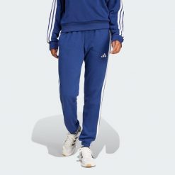 Spodnie Essentials 3-Stripes French Terry Cuffed. Białe obuwie sportowe Adidas, s, bez wzorów, z materiału, na fitness i siłownię. Za 219.00 zł.