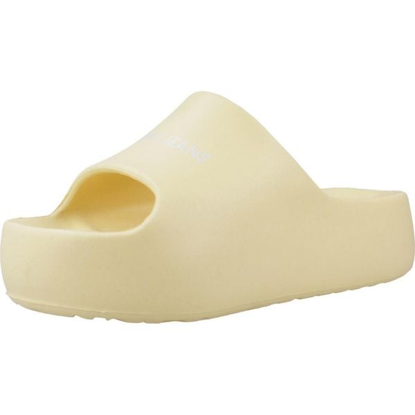 Sandały TOMMY JEANS TJW CHUNKY FLATFORM SLID Żółty. Żółte sandały TOMMY HILFIGER, bez wzorów, z gumy, bez obcasa, bez zapięcia. Za 177.99 zł.