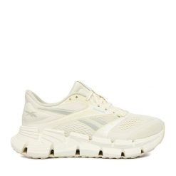 Buty do biegania Reebok. Białe obuwie sportowe Reebok, bez zapięcia, do biegania. Za 489.99 zł.