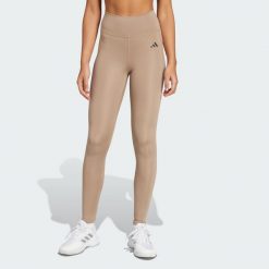 Długie legginsy Optimé Essentials Stash Pocket. Brązowe legginsy Adidas, l, bez wzorów, z elastanu, z podwyższonym stanem, długie. Za 204.20 zł.