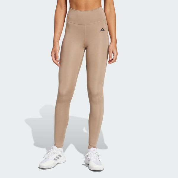Długie legginsy Optimé Essentials Stash Pocket. Brązowe legginsy Adidas, l, bez wzorów, z elastanu, z podwyższonym stanem, na fitness i siłownię. Za 182.50 zł.