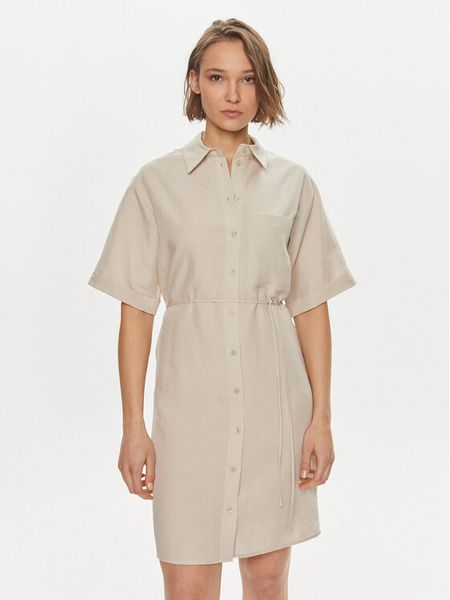 Calvin Klein Sukienka koszulowa K20K206697 Beżowy Relaxed Fit. Brązowe sukienki Calvin Klein, bez wzorów, ze lnu, bez kołnierzyka, bez ramiączek, koszulowe. Za 429.99 zł.