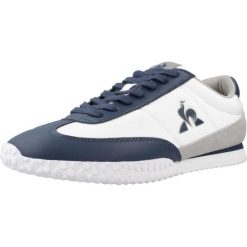 Kapcie LE COQ SPORTIF VELOCE Biały. Białe obuwie domowe Le Coq Sportif, bez wzorów, ze skóry, bez zapięcia. Za 323.25 zł.