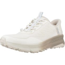 Kapcie SKECHERS SWITCH BACK Beżowy. Brązowe obuwie domowe Skechers, bez wzorów, z syntetyku, bez zapięcia. Za 403.99 zł.