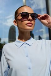 Koszula z wiązaniem błękitna. Niebieskie koszule MOODO, l, bez wzorów, z wiskozy, bez kołnierzyka, bez ramiączek. Za 119.99 zł.