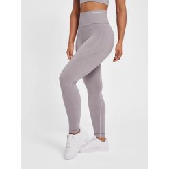 Legginsy damskie Hummel MT Flow. Fioletowe legginsy Hummel, l, bez wzorów, z dzianiny. Za 256.50 zł.