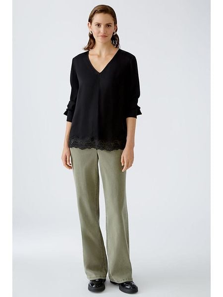 Oui Bluzka w kolorze czarnym rozmiar: 34. Czarne bluzki Oui, bez wzorów, z koronki, bez kołnierzyka, bez ramiączek. Za 165.99 zł.