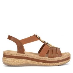 Sandały Rieker. Brązowe sandały Rieker, bez wzorów, bez obcasa, na koturnie, bez zapięcia. Za 329.99 zł.