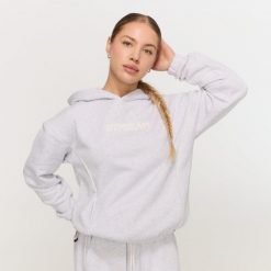 Bluza damska fitness z kapturem szara Varsity. Szare bluzy GYMBEAM, m, bez wzorów, z materiału, z kapturem. Za 139.90 zł.