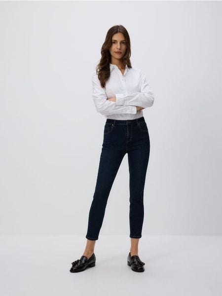 Jeansy slim fit mid rise - granatowy. Niebieskie jeansy Reserved, bez wzorów. Za 99.99 zł.