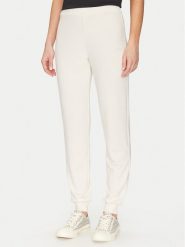 Guess Spodnie materiałowe O5GB05 KCQP2 Granatowy Regular Fit. Niebieskie spodnie materiałowe Guess, xs, z aplikacjami, z materiału. Za 109.99 zł.