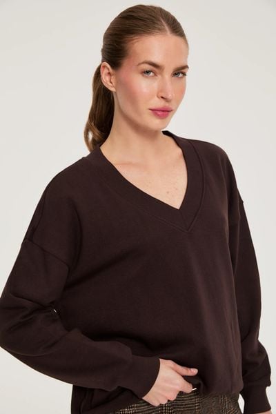 Bluza z dekoltem w serek brązowa. Brązowe bluzy MOODO, l, bez wzorów, z bawełny, bez kaptura. Za 89.99 zł.