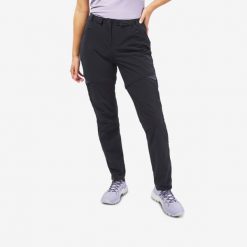 Spodnie turystyczne damskie MH550 2w1. Czarne spodnie sportowe QUECHUA, l, bez wzorów, z elastanu, trekkingowe. Za 179.99 zł.