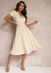 Beżowa Sukienka Taliowana z Kopertowym Dekoltem o Rozkloszowanym Kroju Rimadea. Brązowe sukienki Renee, l, bez wzorów, eleganckie, bez kołnierzyka, bez ramiączek, midi, kopertowe. Za 119.99 zł.